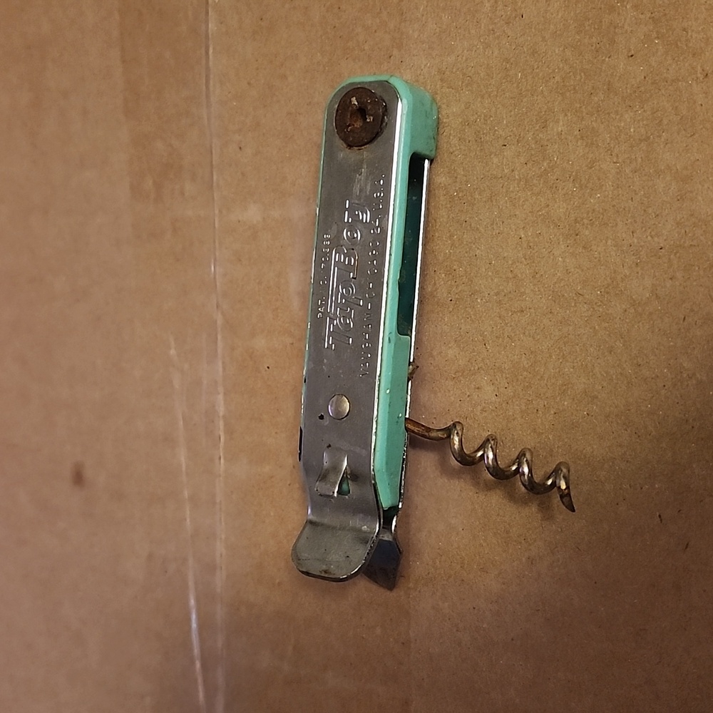 Vintage can opener with cork screw